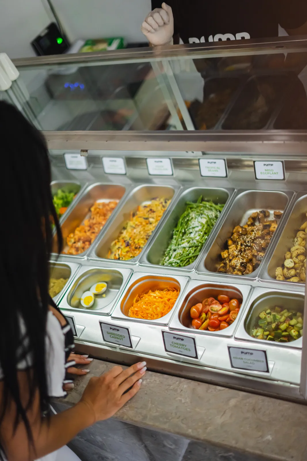 The build-your-own servery counter, trays labelled and weighed